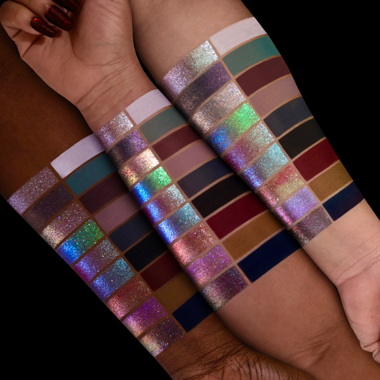 All 18 Simply Meant To Be eyeshadows swatched on light, medium and deep skin tones, with matte and sparkling multichrome finishes against black.
